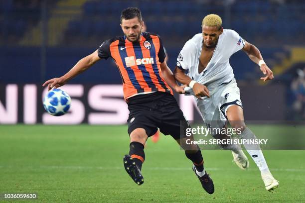 Shakhtar's David Khocholava vies with Hoffenheim's Joelinton Cassio during the UEFA Champions League Group F football match between FC Shakhtar...