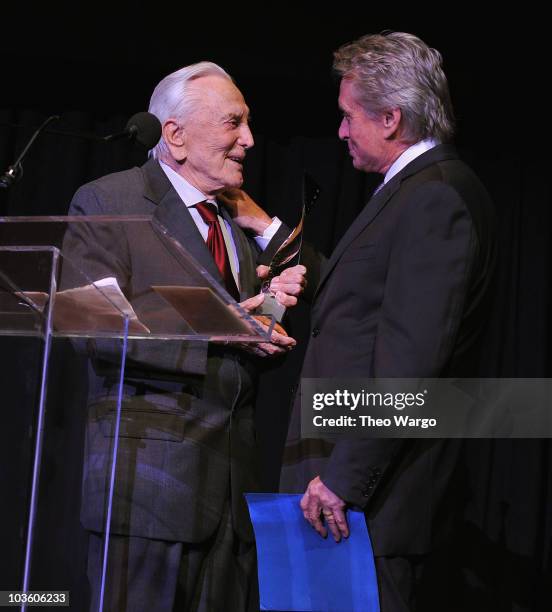 Kirk Douglas presents his son Michael Douglas with an award during the The Film Society of Lincoln Center's 37th Annual Chaplin Award gala>> at Alice...