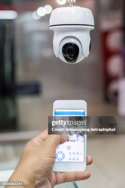 male hand press phone watch cctv - security camera view stock pictures, royalty-free photos & images