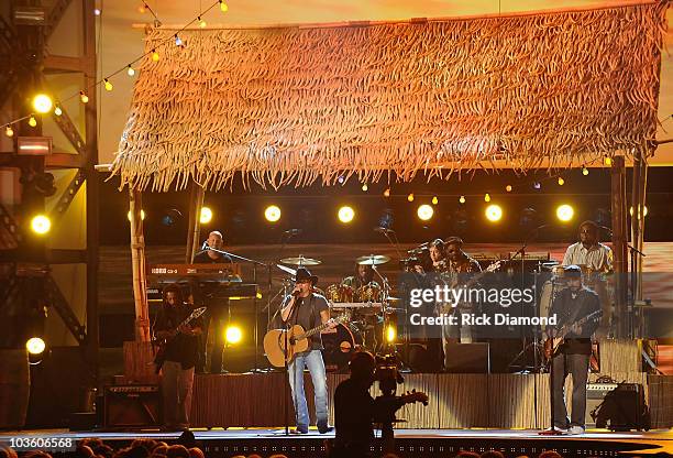 Musician Kenny Chesney performs "Everybody Wants to Go to Heaven" and "Three Little Birds" with the Wailers on stage during the 42nd Annual CMA...