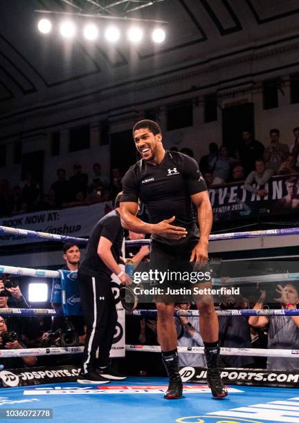 Anthony Joshua reacts during an Anthony Joshua and Alexander Povetkin Media Workout on September 19, 2018 in London, England.