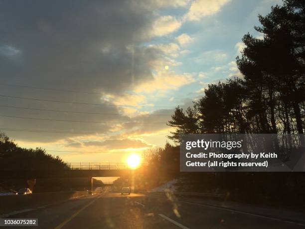 magic hour: driving on a highway into the sunset - new jersey turnpike stock pictures, royalty-free photos & images