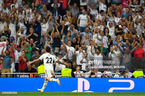 Real Madrid's Spanish midfielder Isco celebrates scoring the opening goal during the UEFA Champions League group G football match between Real Madrid...
