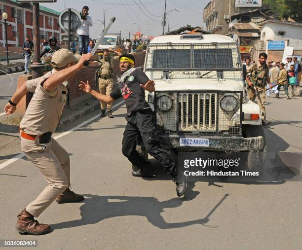Police detains mourners during a Muharram procession at Lal chowk area on September 19, 2018 in Srinagar, India.