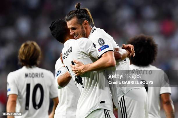Real Madrid's Welsh forward Gareth Bale celebrates scoring his team's second goal during the UEFA Champions League group G football match between...
