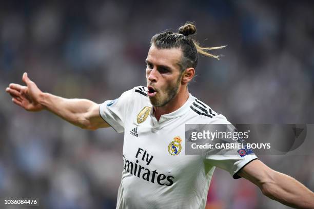 Real Madrid's Welsh forward Gareth Bale celebrates scoring his team's second goal during the UEFA Champions League group G football match between...