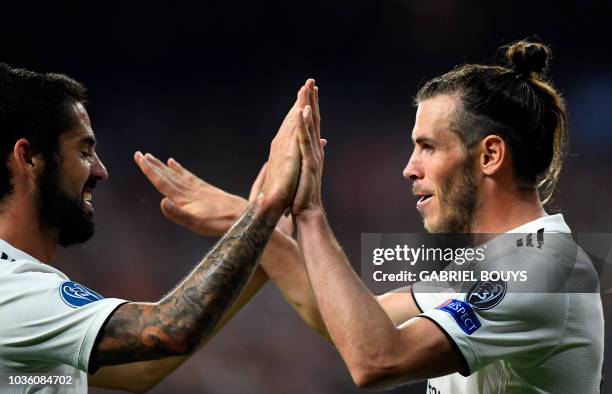 Real Madrid's Welsh forward Gareth Bale celebrates scoring his team's second goal with Real Madrid's Spanish midfielder Isco during the UEFA...