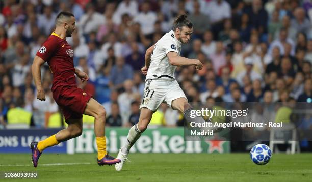 Gareth Bale of Real Madrid scores his team's second goal during the Group G match of the UEFA Champions League between Real Madrid and AS Roma at...