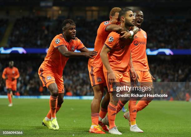 Nabil Fekir of Lyon celebrates after scoring his team's second goal with his team mates during the Group F match of the UEFA Champions League between...