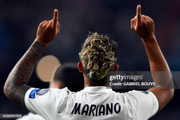 Real Madrid's Spanish-Dominican forward Mariano celebrates his goal during the UEFA Champions League group G football match between Real Madrid CF...