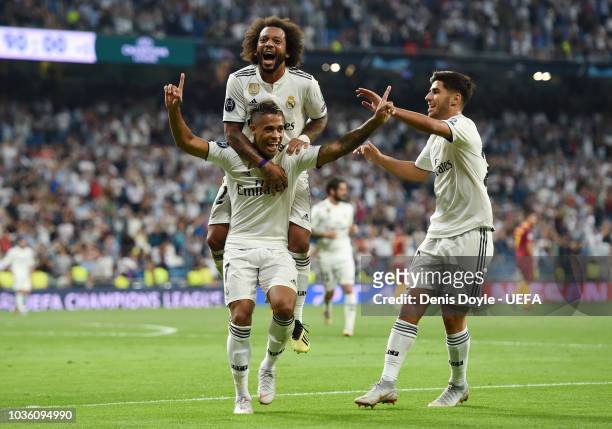 Mariano Diaz of Real Madrid celebrates with teammates after scoring his team's third goal during the Group G match of the UEFA Champions League...