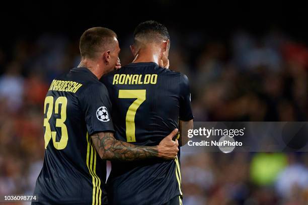 Cristiano Ronaldo of Juventus cries after taking a red card next to his teammate Federico Bernardeschi during the UEFA Champions League group H match...