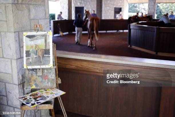 An easel stands with a watercolor painting during the 75th annual Keeneland September Yearling Sale at Keeneland Racecourse in Lexington, Kentucky,...