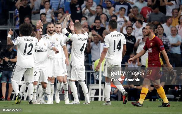 Gareth Bale of Real Madrid celebrates after scoring a goal with his team mates during UEFA Champions League Group G soccer match between Real Madrid...