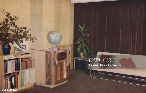 Mr. J. C. Pritchard's sitting-room in the Isokon Lawn Road Flats, London, England, designed by Wells Coates', 1936. Walls in panelled Venesta birch,...