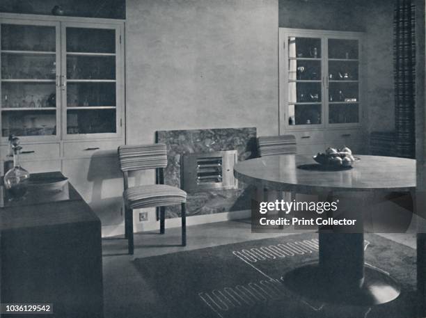 Dining-room for a house in Highgate Village, London. Architect: C. H. James, F.R.I.B.A.', 1936. Salubra wallpaper, linoleum floor with hand-tufted...