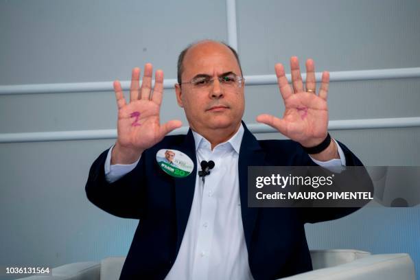 The candidate for Governor of Rio de Janeiro for the Christian Social Party , Wilson Witzel, gestures during a televised debate in Rio de Janeiro,...