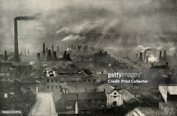 Factoryscape in the Potteries', . Smoke from chimneys in the industrial area known as the Staffordshire Potteries, Stoke-on-Trent. Due to the local...
