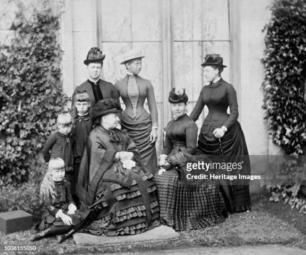 Queen Victoria and her family, Balmoral, Scotland, 1884. Photograph from a Royal Family album at Osborne House, Isle of Wight. Seated - on the...