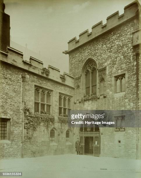 Dean's Yard, Westminster Abbey, London, 1886. Entrance to the cloisters from Dean's Yard with a policeman standing beside the gate. Artist Henry...