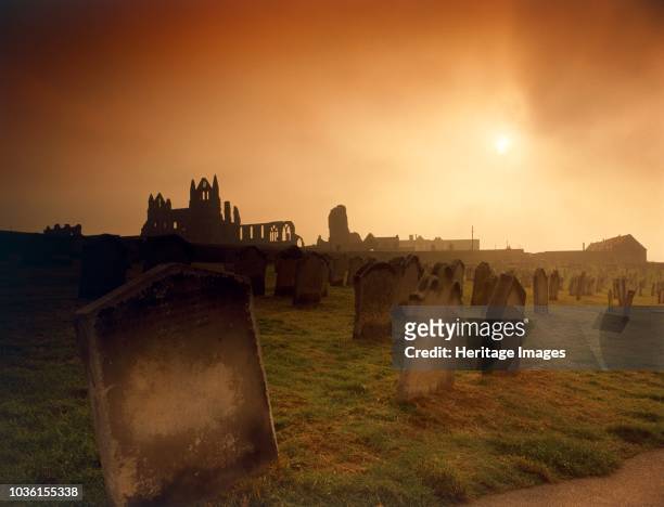 Whitby Abbey, North Yorkshire, 2010. View from St Mary's Church towards the abbey in hazy sunshine. Artist Mike Kipling.