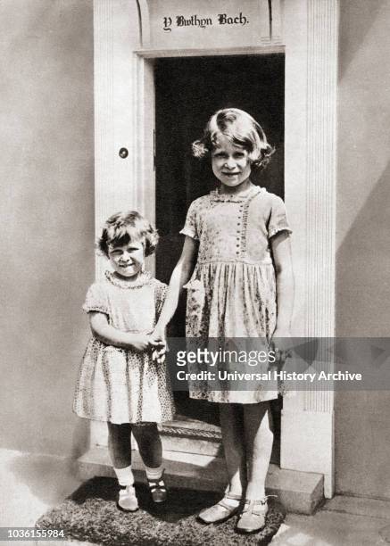 Princess Elizabeth, right, and her sister Princess Margaret in 1933 at Y Bwthyn Bach or The Little House, situated in the garden of the Royal Lodge,...
