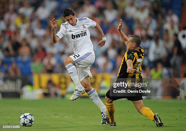 Angel Di Maria of Real Madrid beats a Penarol player during the Santiago Bernabeu Trophy match between Real Madrid and Penarol at the Santiago...