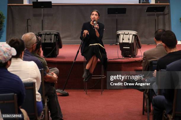 Alexandria Ocasio-Cortez, Democratic candidate running for New York's 14th Congressional district, answers questions at a town hall event, September...