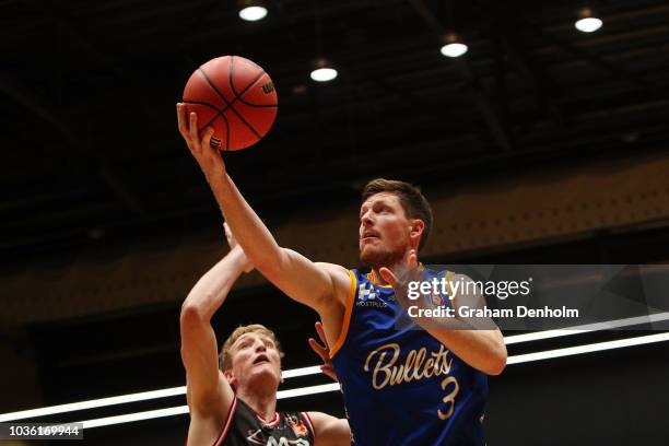 Cameron Gliddon of the Brisbane Bullets drives at the basket during the NBL Blitz pre-season match between Brisbane Bullets and Illawara Hawks at...