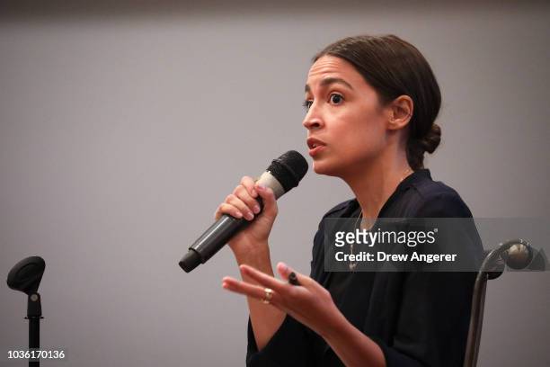 Alexandria Ocasio-Cortez, Democratic candidate running for New York's 14th Congressional district, answers questions at a town hall event, September...
