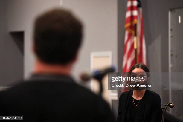 Alexandria Ocasio-Cortez, Democratic candidate running for New York's 14th Congressional district, answers questions at a town hall event, September...