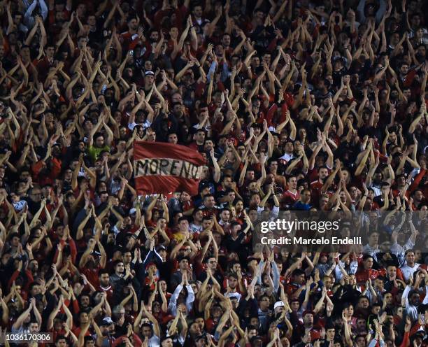 Fans of Independiente cheer for their team during a quarter final first leg match between Independiente and River Plate as part of Copa CONMEBOL...