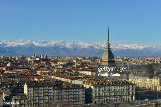 Overview of the city with the spire of the Mole Antonelliana and the Alps in the background, from the hill of Monte Dei Cappuccini