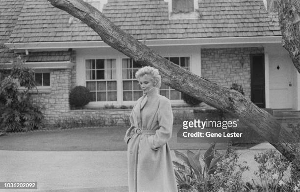 American actress Marilyn Monroe poses outside her home during a photo call, California, USA, 1956.