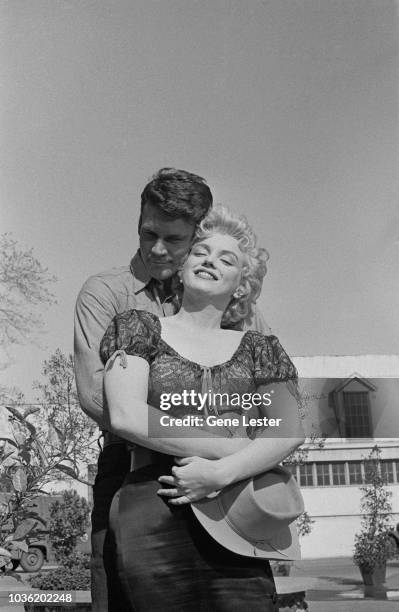 American actress Marilyn Monroe with co-star Don Murray, during a press call to publicise, Joshua Logan's 'Bus Stop', 1956.