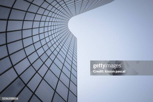 reflection on office building glass windows with curve lines. - arquitectura exterior fotografías e imágenes de stock