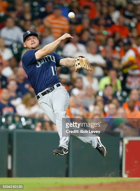 Kyle Seager of the Seattle Mariners throws to first base but unable to retire George Springer of the Houston Astros in the fourth inning at Minute...