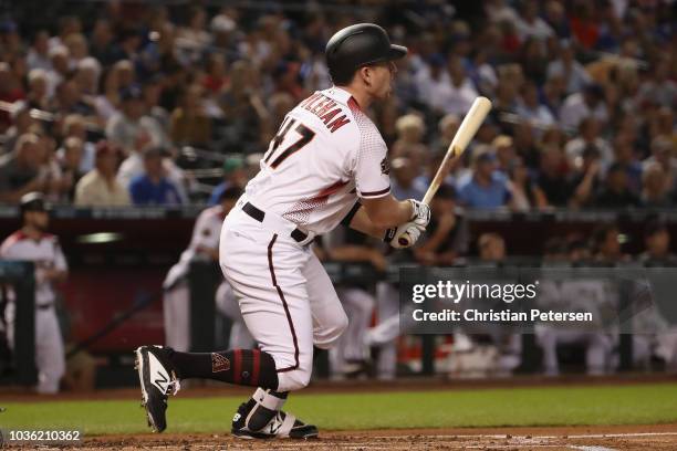 Patrick Kivlehan of the Arizona Diamondbacks hits a triple against the Chicago Cubs during the first inning of the MLB game at Chase Field on...