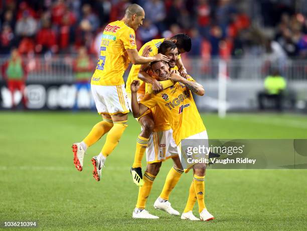Jesús Dueñas of Tigres UANL celebrates a goal with teammates during the second half of the 2018 Campeones Cup Final against Toronto FC at BMO Field...