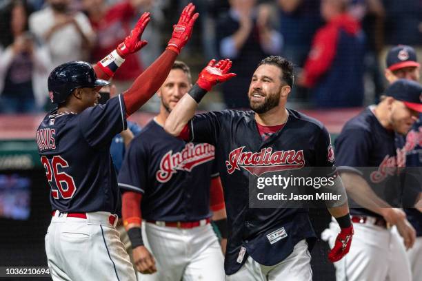 Rajai Davis celebrates with Jason Kipnis of the Cleveland Indians after Kipnis hit a walk-off grand slam to defeat the Chicago White Sox at...