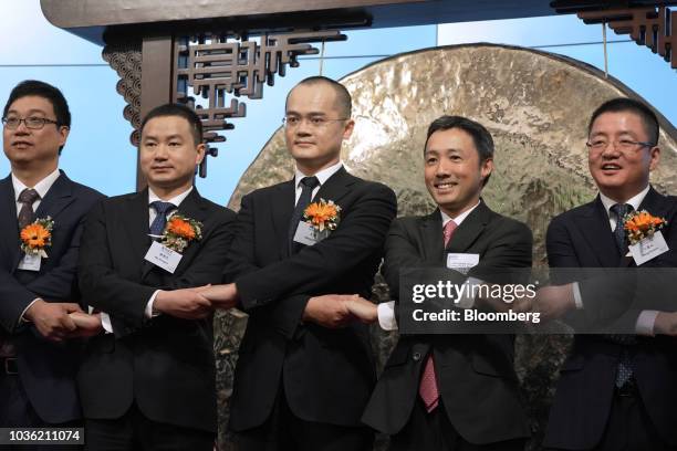 Zhang Chuan, senior vice president at Meituan Dianping, from left, Mu Rongjun, senior vice president and co-founder of Meituan Dianping, Wang Xing,...