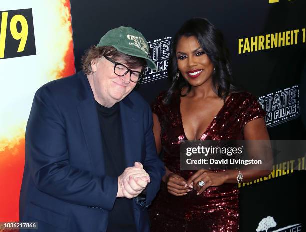 Michael Moore and Omarosa Manigault Newman attend the premiere of Briarcliff Entertainment's "Fahrenheit 11/9" at Samuel Goldwyn Theater on September...