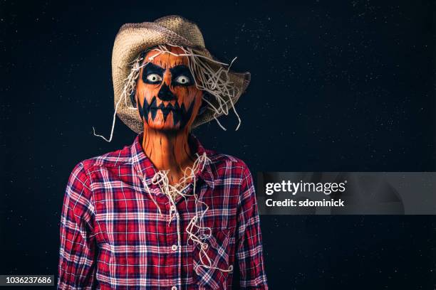 spooky pumpkin head scarecrow halloween costume - scarecrow faces stock pictures, royalty-free photos & images