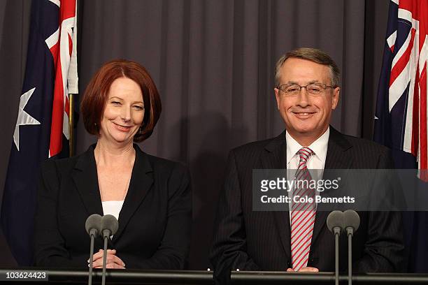 Julia Gillard and Wayne Swan speak during a press conference at National Press Club on August 25, 2010 in Canberra, Australia. The 3 Independents and...