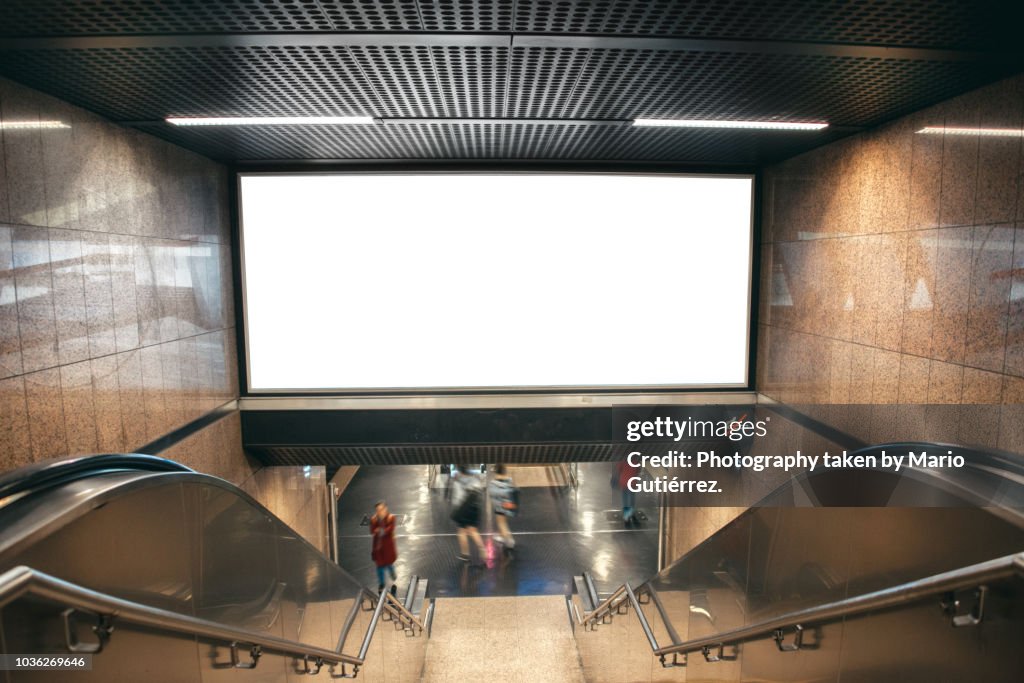 Blank billboard at subway station