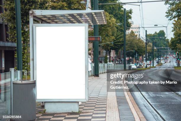 tram stop with billboard - tram stock pictures, royalty-free photos & images