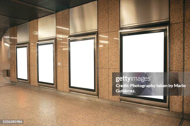 four blank billboards at subway station - subway poster stock pictures, royalty-free photos & images