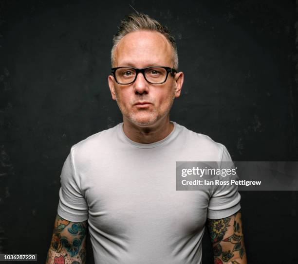 tattooed man in white shirt - white t shirt studio stock pictures, royalty-free photos & images