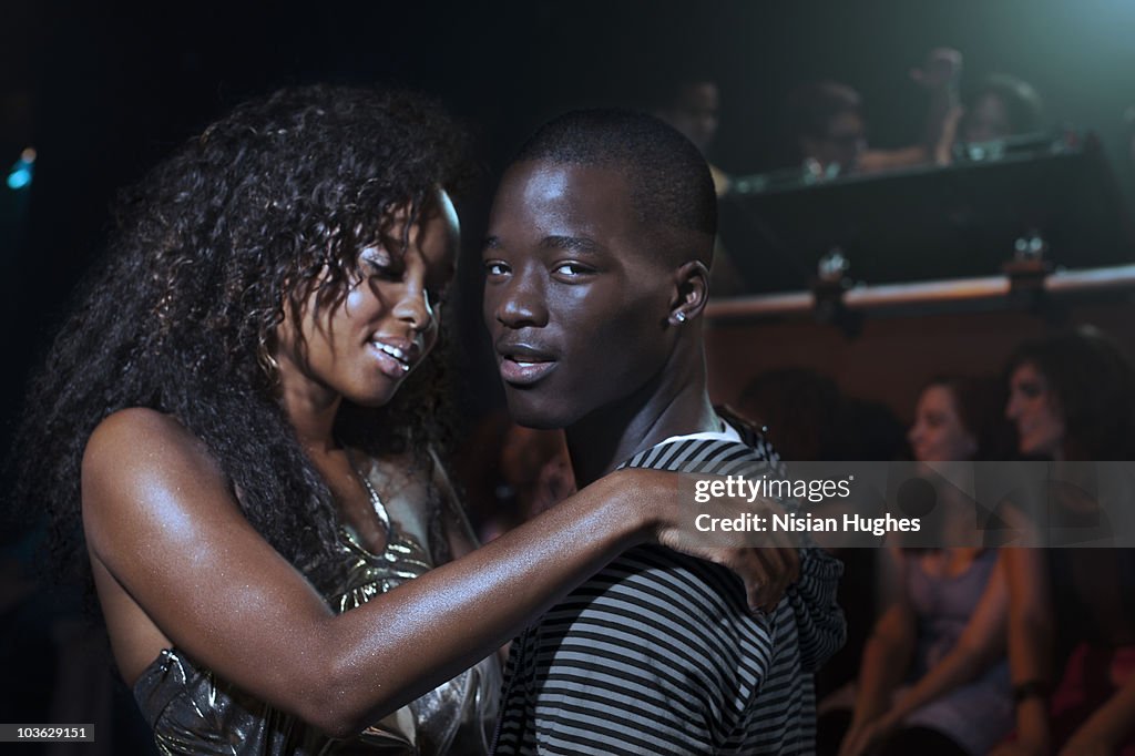 Young couple together in nightclub