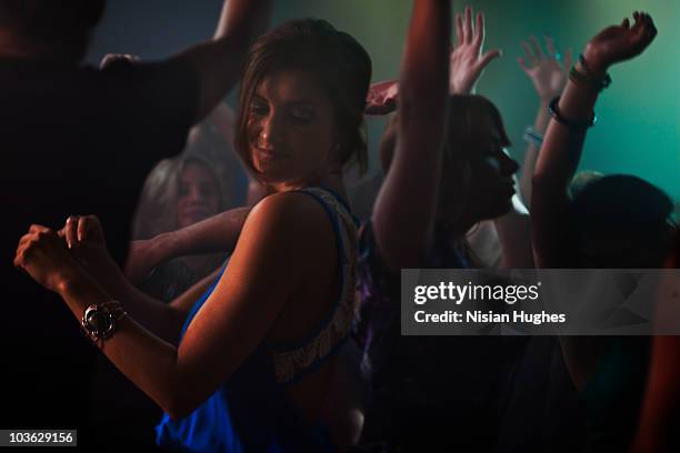 people dancing in nightclub - dance music stock pictures, royalty-free photos & images